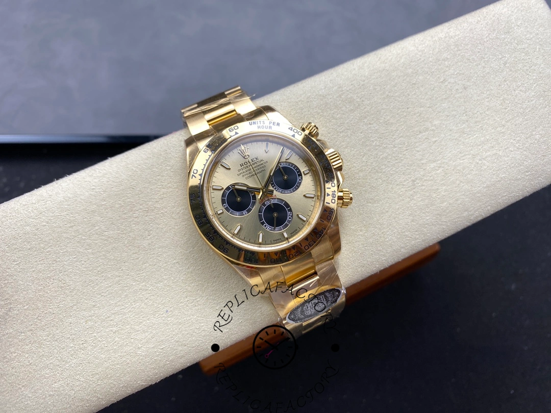 Full watch view of Rolex Daytona 126508 on cushion, showing gold bracelet and chronograph dial.