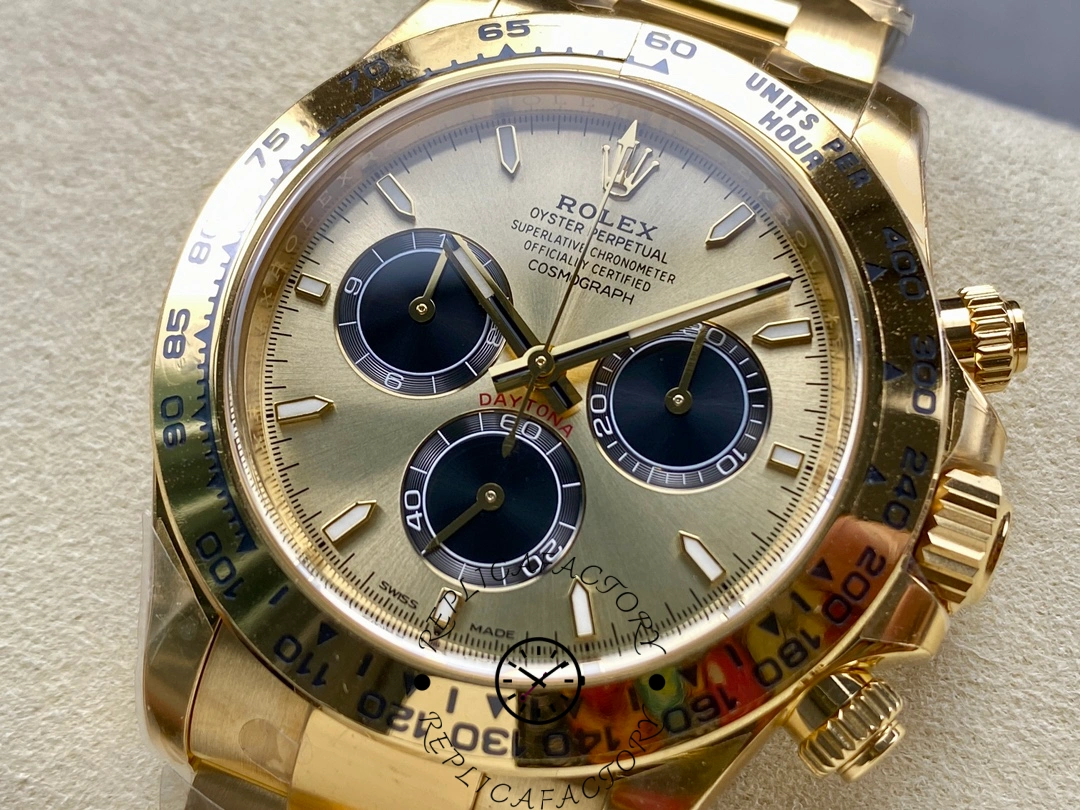 Macro shot of Rolex Daytona 126508 showing brushed gold dial and contrasting black chronograph counters.