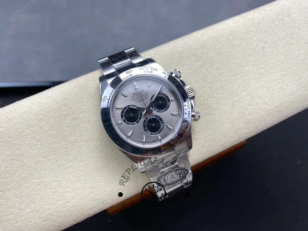 Rolex Daytona 126509-0003 displayed on cushion, showing full watch with silver dial and tachymeter bezel.