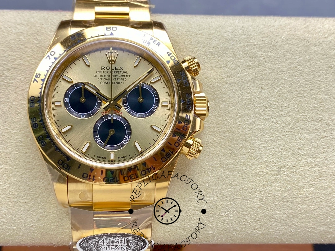 Close-up of Rolex Daytona 126508 showing gold dial, black subdials, and engraved tachymeter bezel.