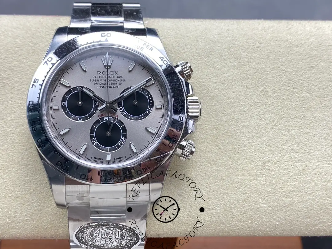 Close front view of Rolex Daytona 126509-0003 highlighting silver dial, three black subdials, and engraved bezel.