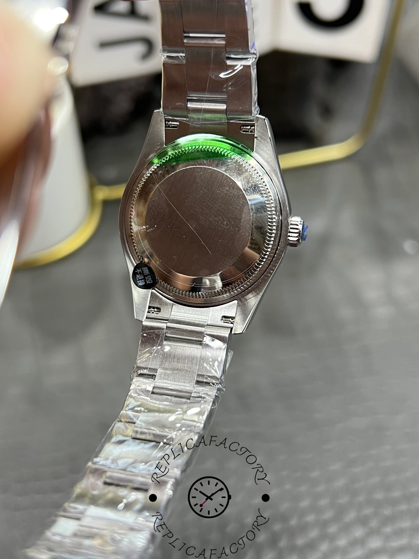 Rear view of the Rolex Oyster Perpetual 31 277200 replica showing solid screw-down case back.