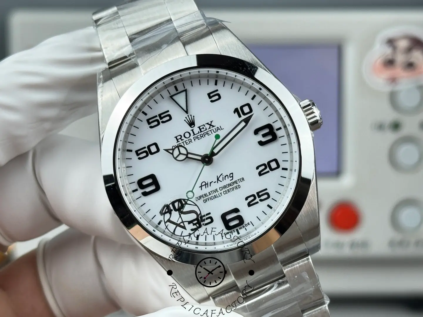 Close-up of Rolex Air-King 126900 dial showing aviation minute scale and Mercedes hour hand.