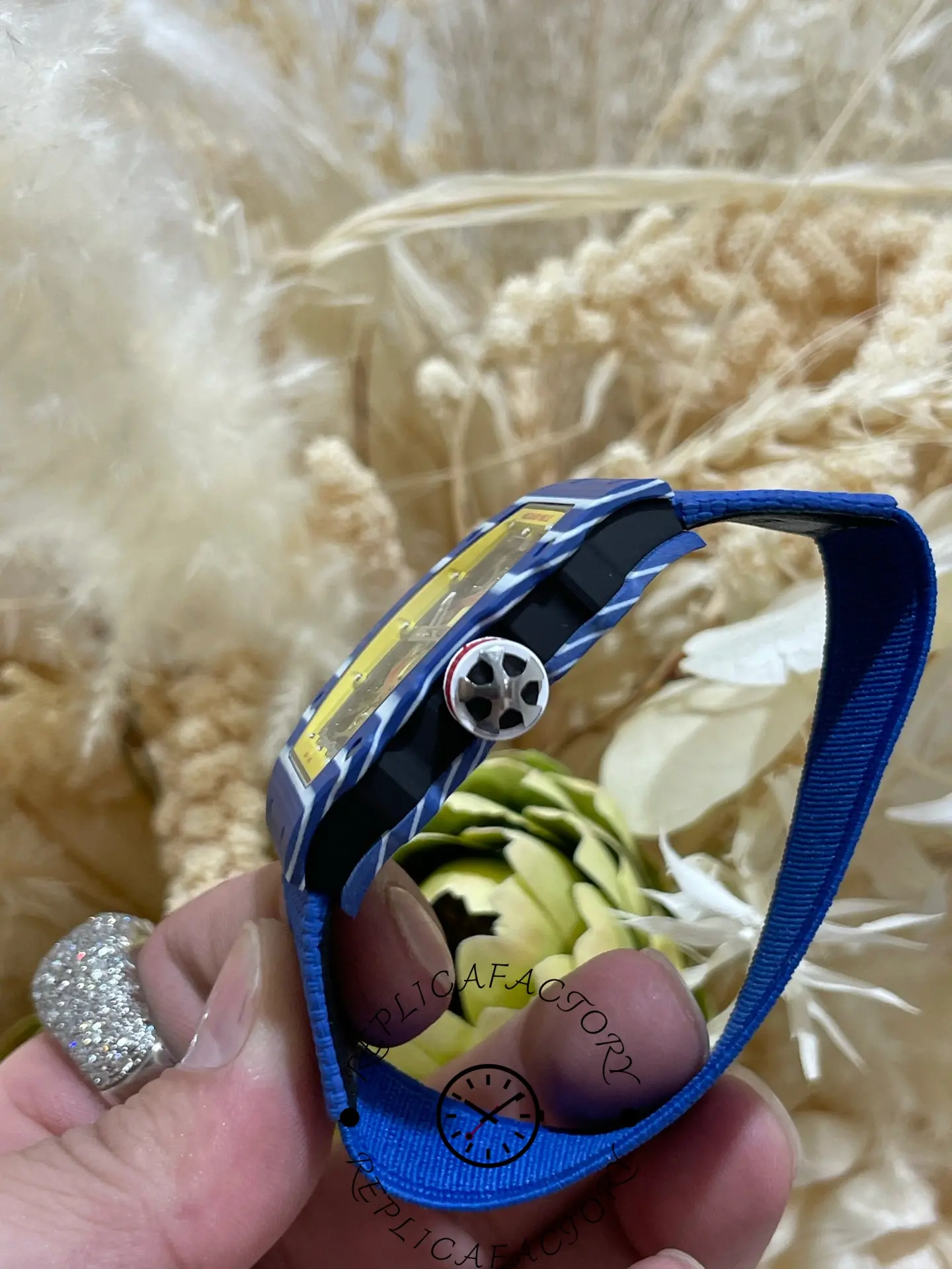 Side view of Richard Mille RM 67-02 replica with blue fabric strap and slim case profile.