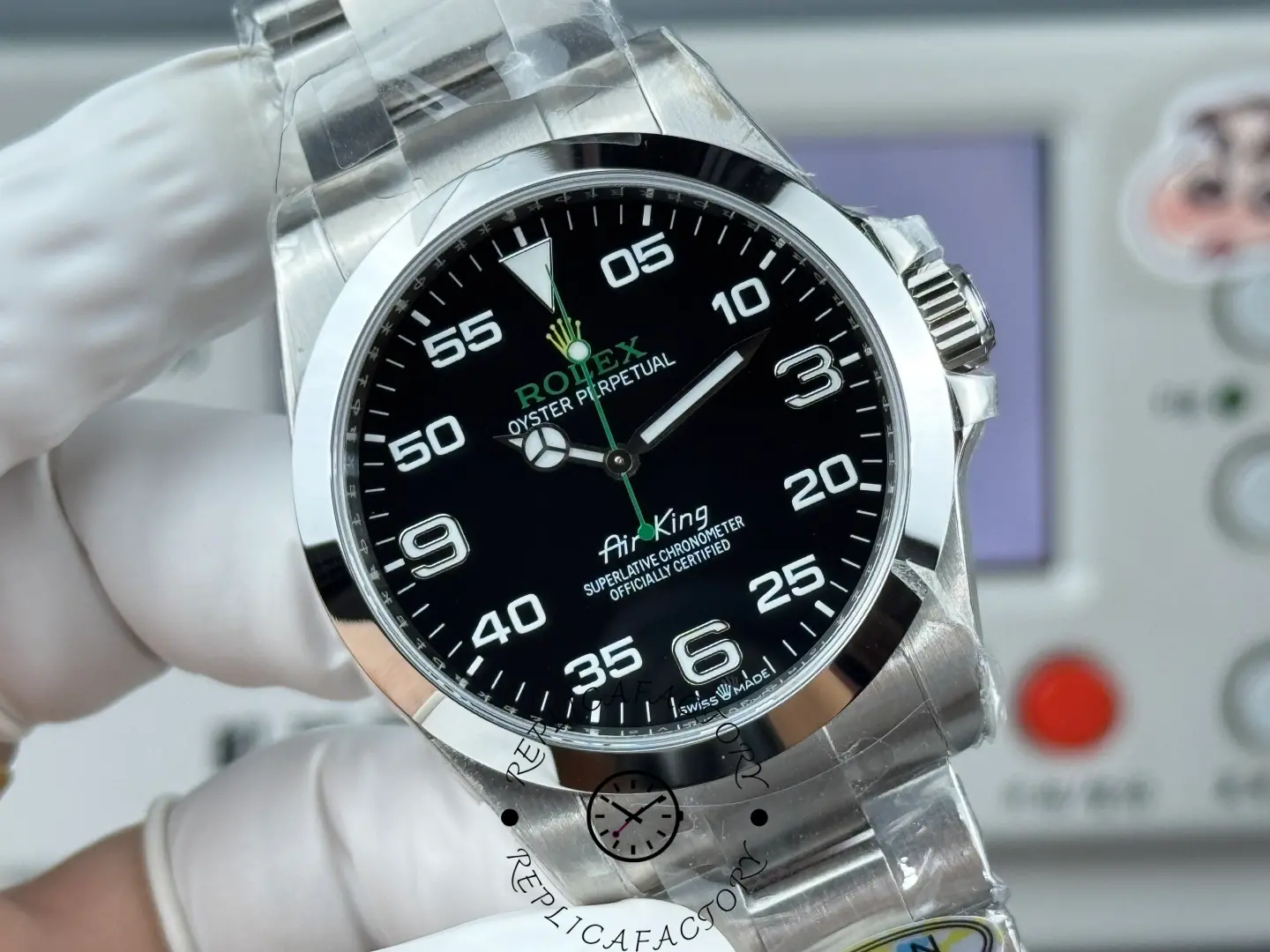 Close-up of Rolex Air-King 126900 dial showing applied numerals, minute scale, and Mercedes hour hand.