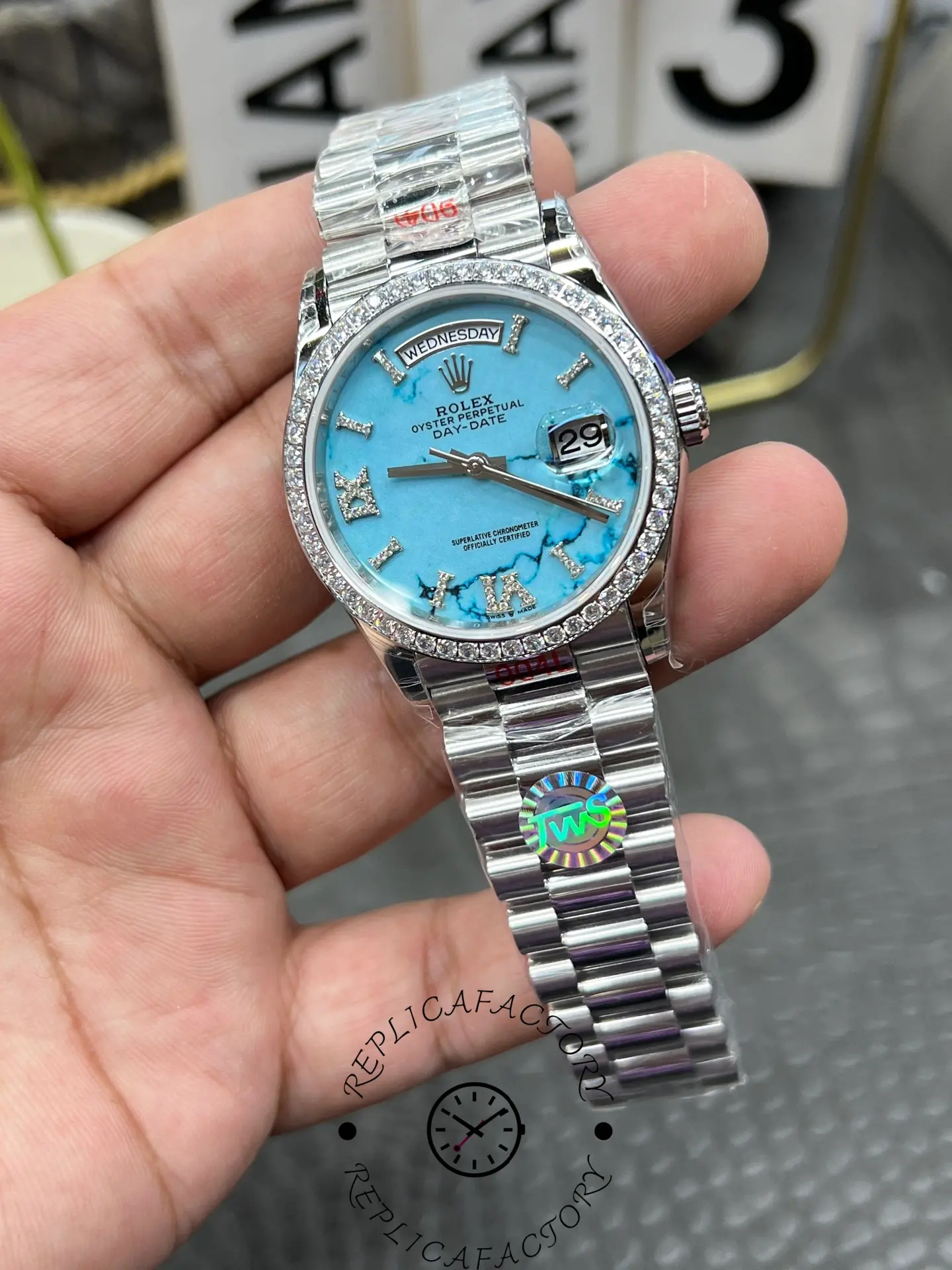 Side view of Rolex Day-Date 128349RBR-0031 showing polished case and screw-down crown.