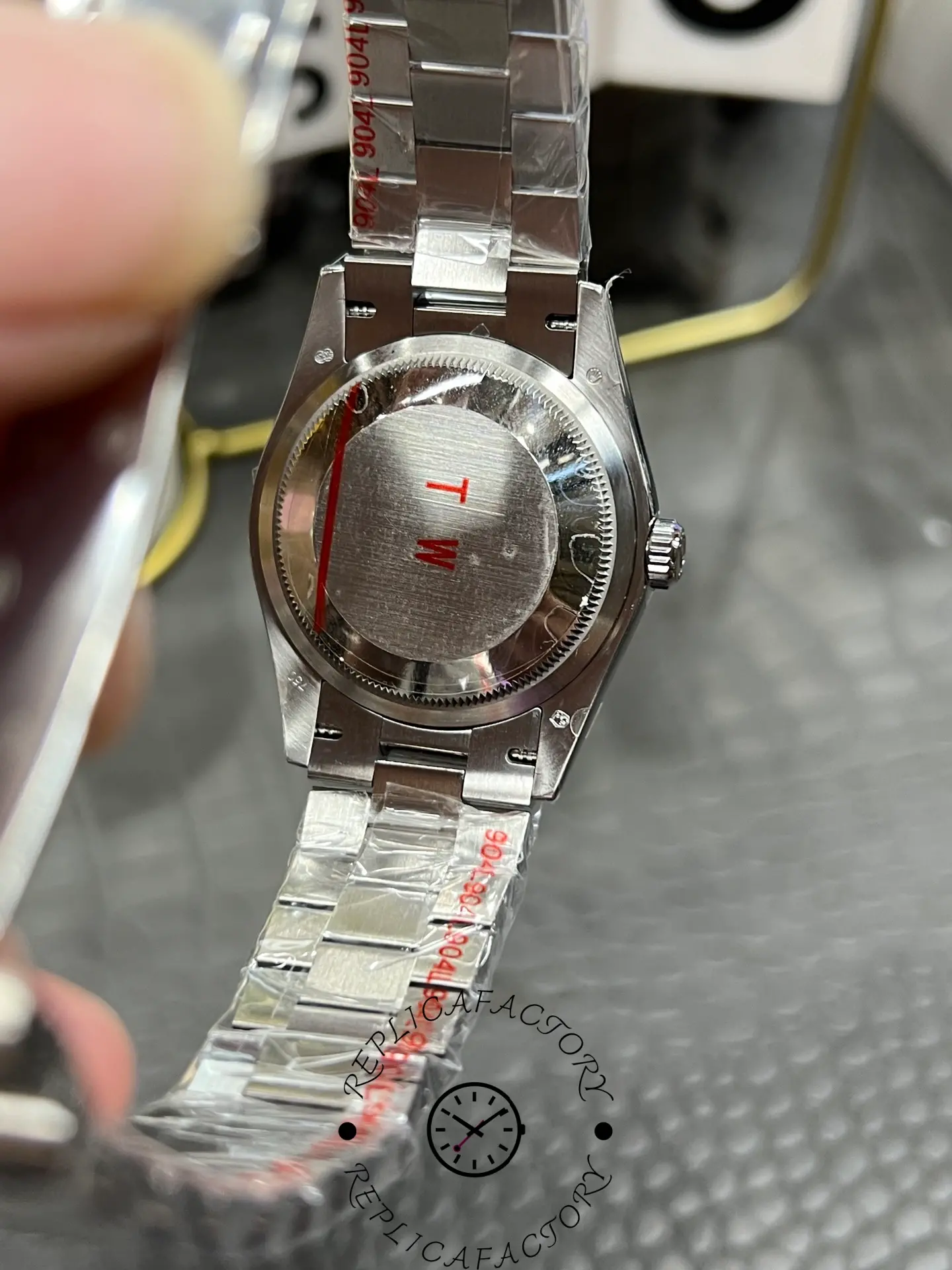 Case back view of Rolex Day-Date 128349RBR-0031 showing solid screw-down back.