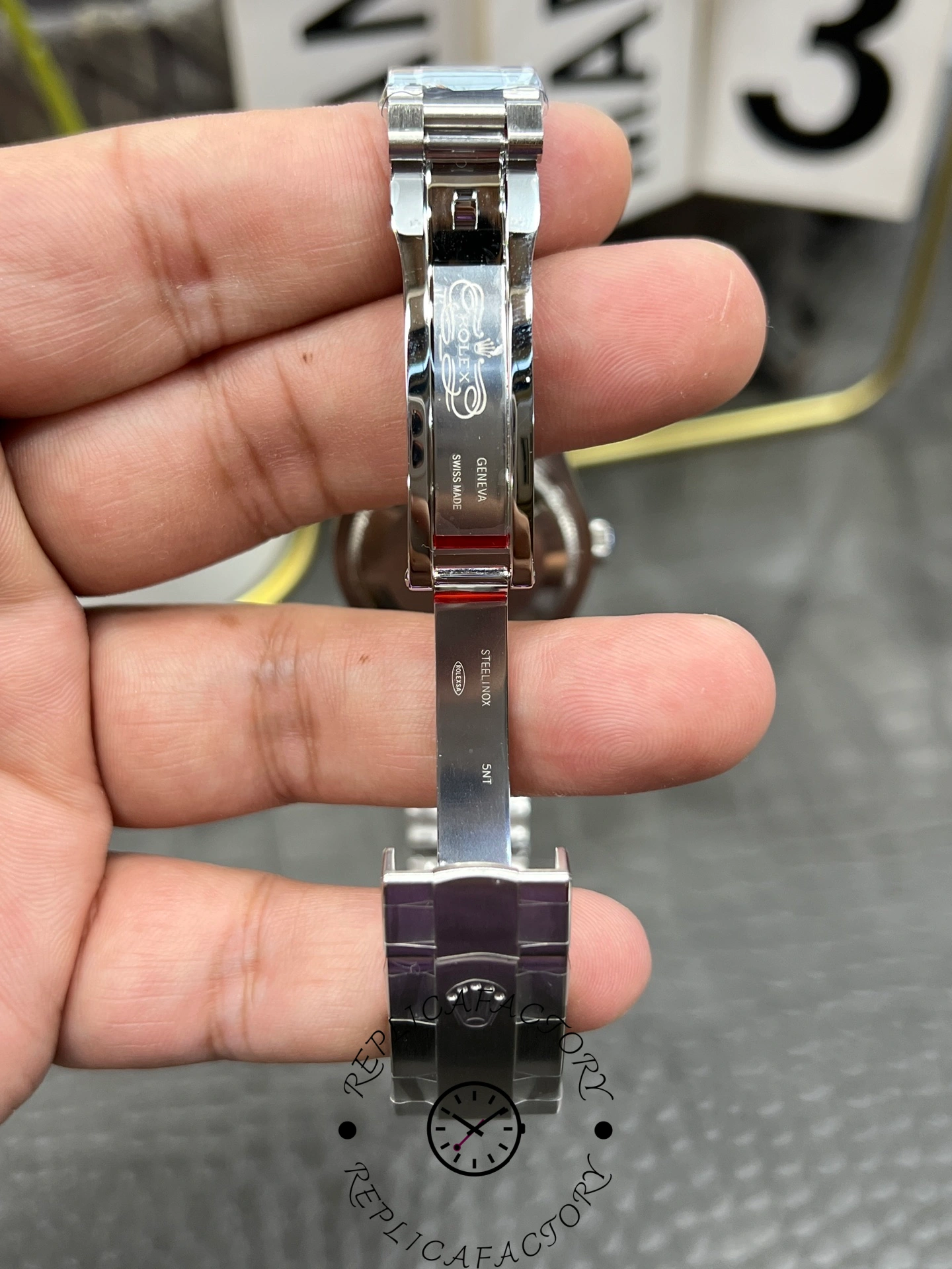 Inner clasp detail of the Rolex Oyster Perpetual 31 277200 replica showing polished folding clasp.