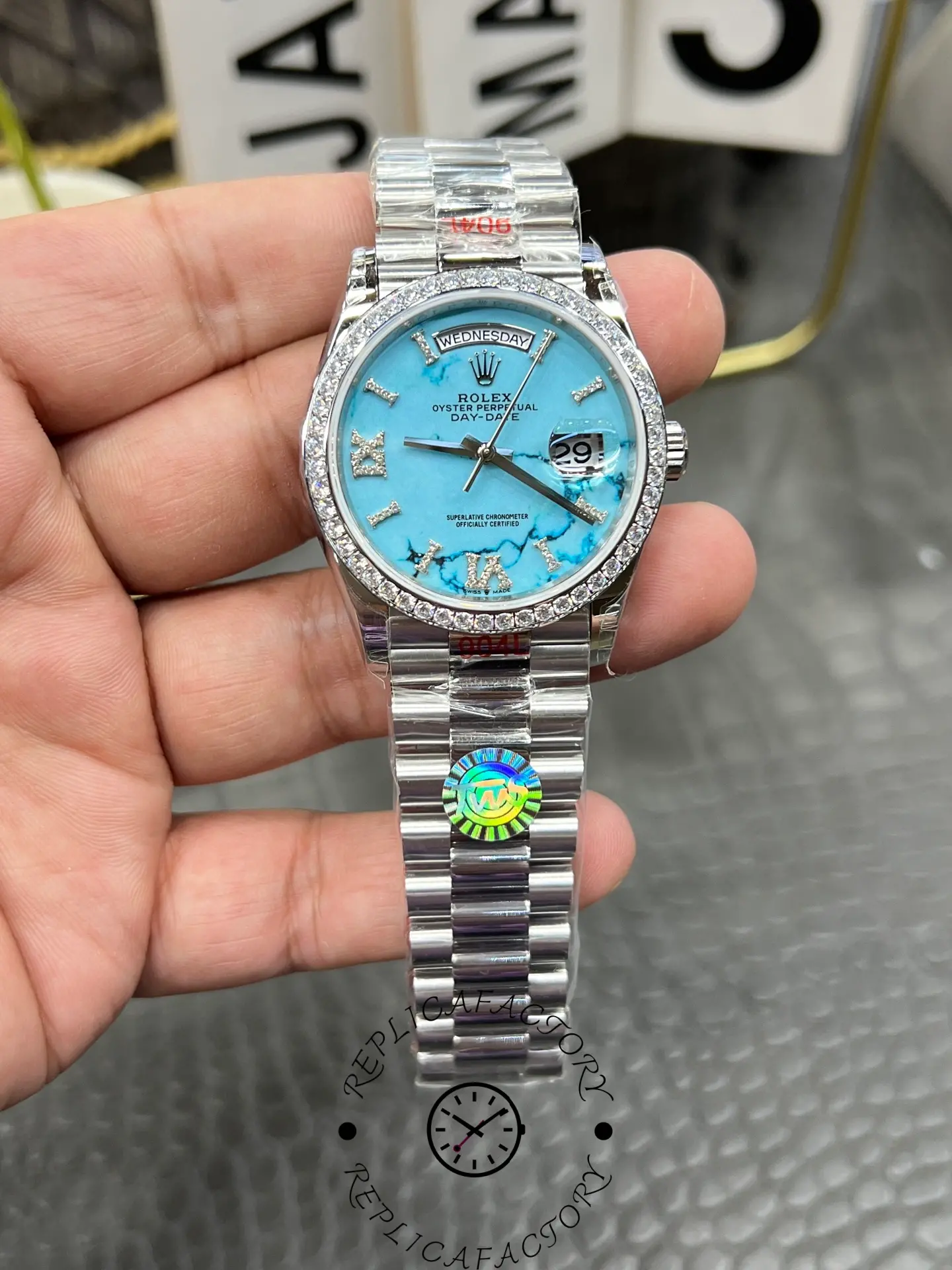 Front view of Rolex Day-Date 128349RBR-0031 showing turquoise dial and diamond-set bezel.