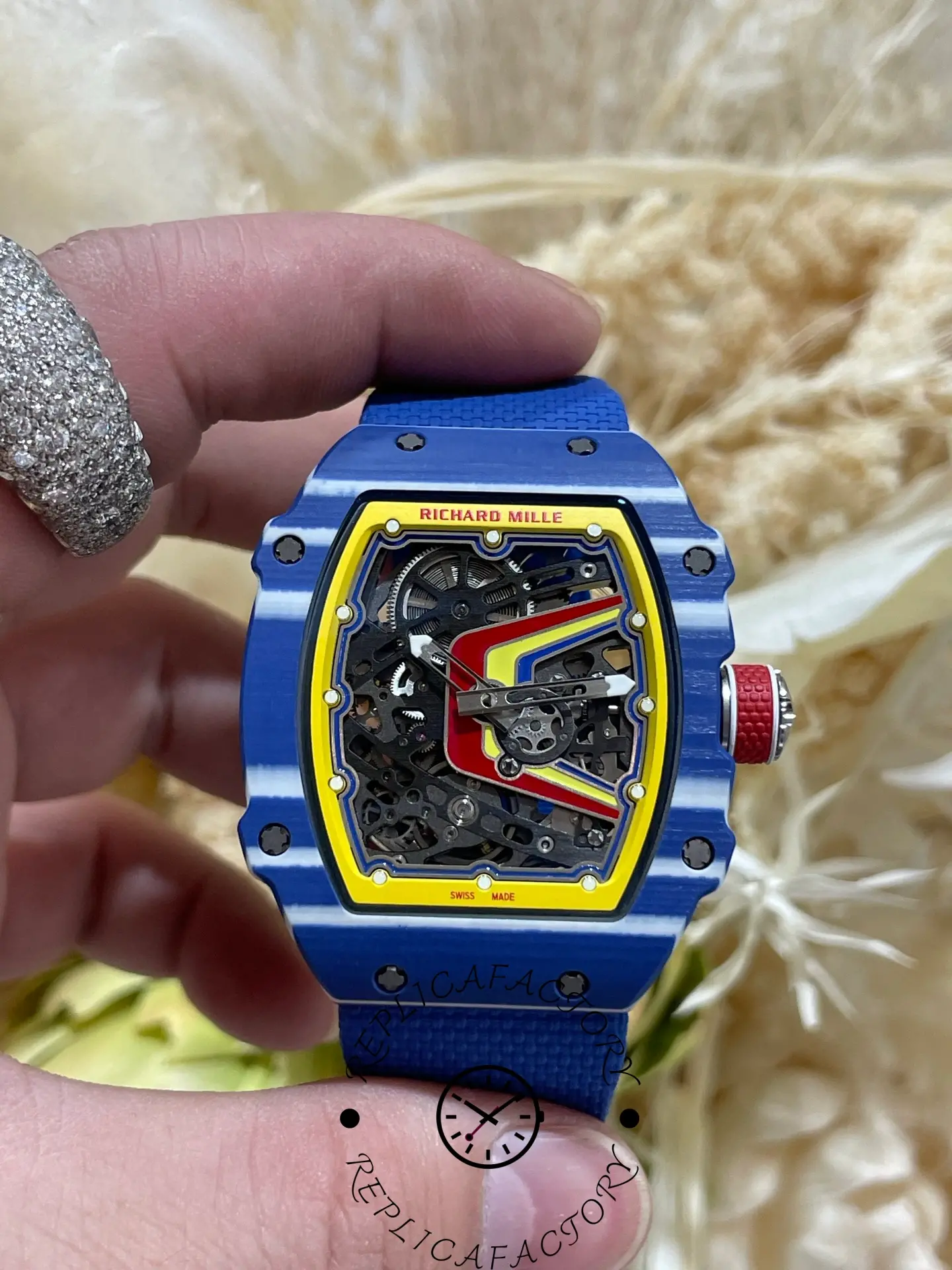 Side profile of Richard Mille RM 67-02 replica showing red crown and layered carbon-style case.