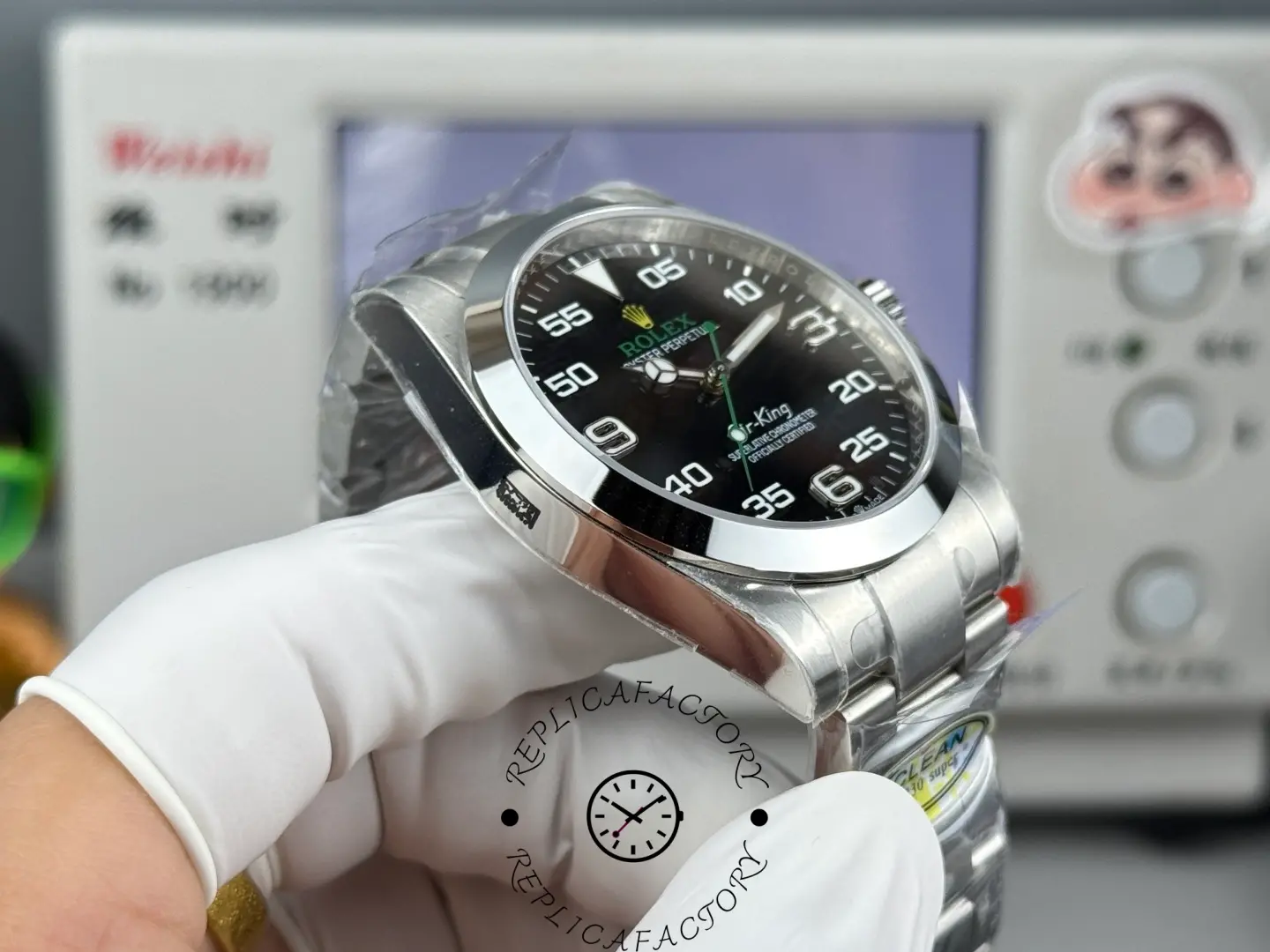 Angled side view of Rolex Air-King 126900 showing polished smooth bezel, crown guards, and stainless steel case profile.