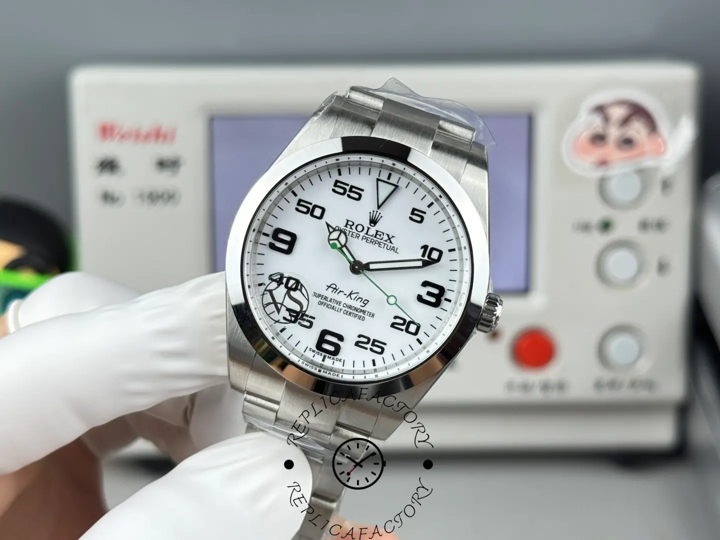 The Rolex Air-King 126900 watch features a white aviation dial, striking Arabic numerals, and a green seconds hand.