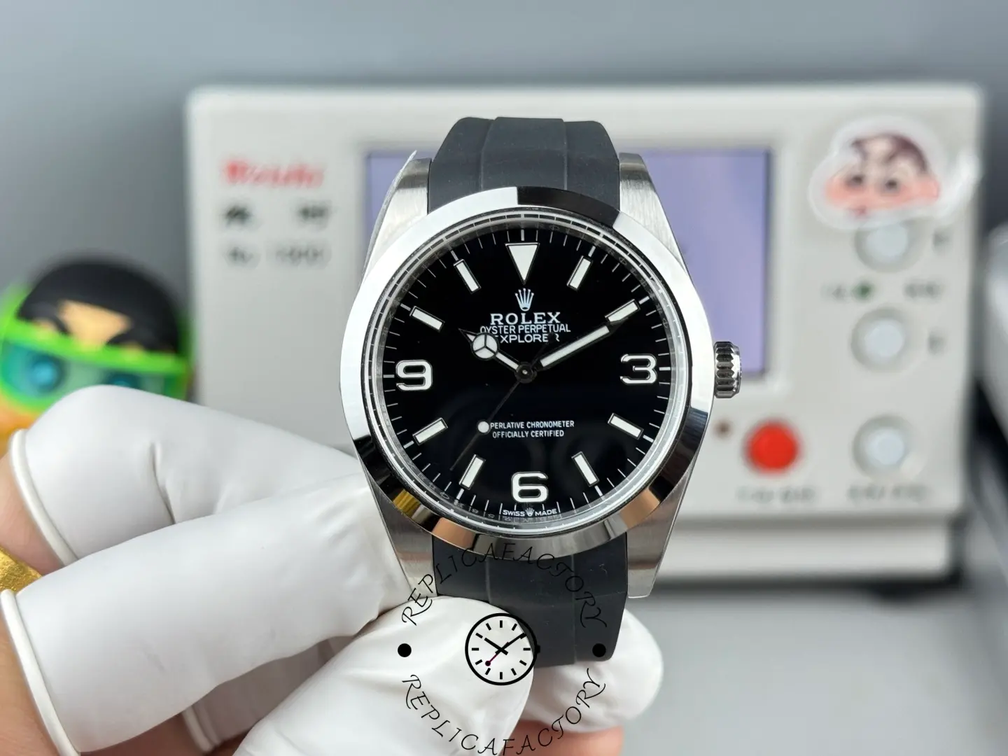 Handheld view of Rolex Explorer 224270 highlighting black dial and rubber strap.