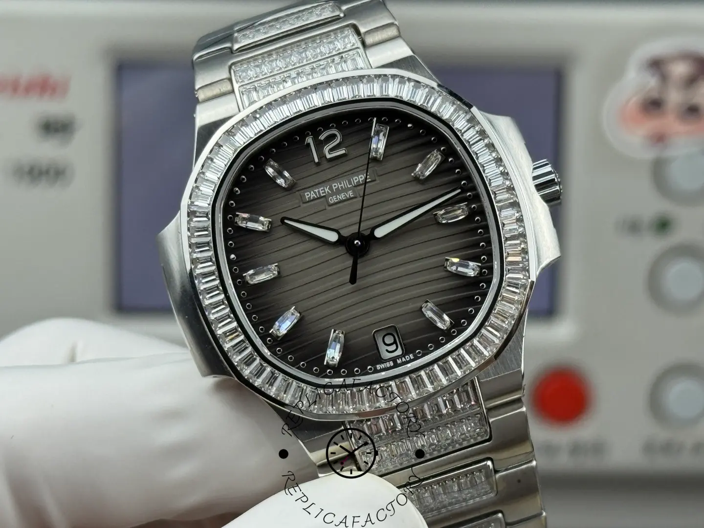 Detailed front angle of Patek Philippe Nautilus 7014-1G-001 replica emphasizing bezel setting and case finishing.