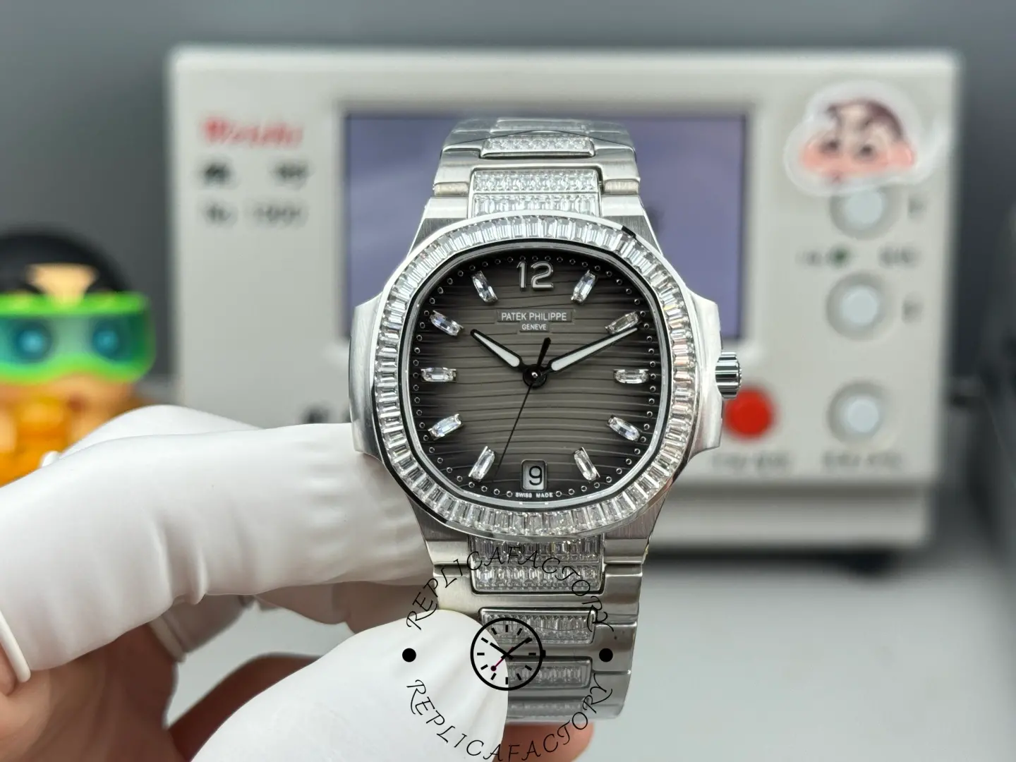 Hand-held front view of Nautilus 7014-1G-001 replica highlighting baguette hour markers and date window at 6 o’clock.