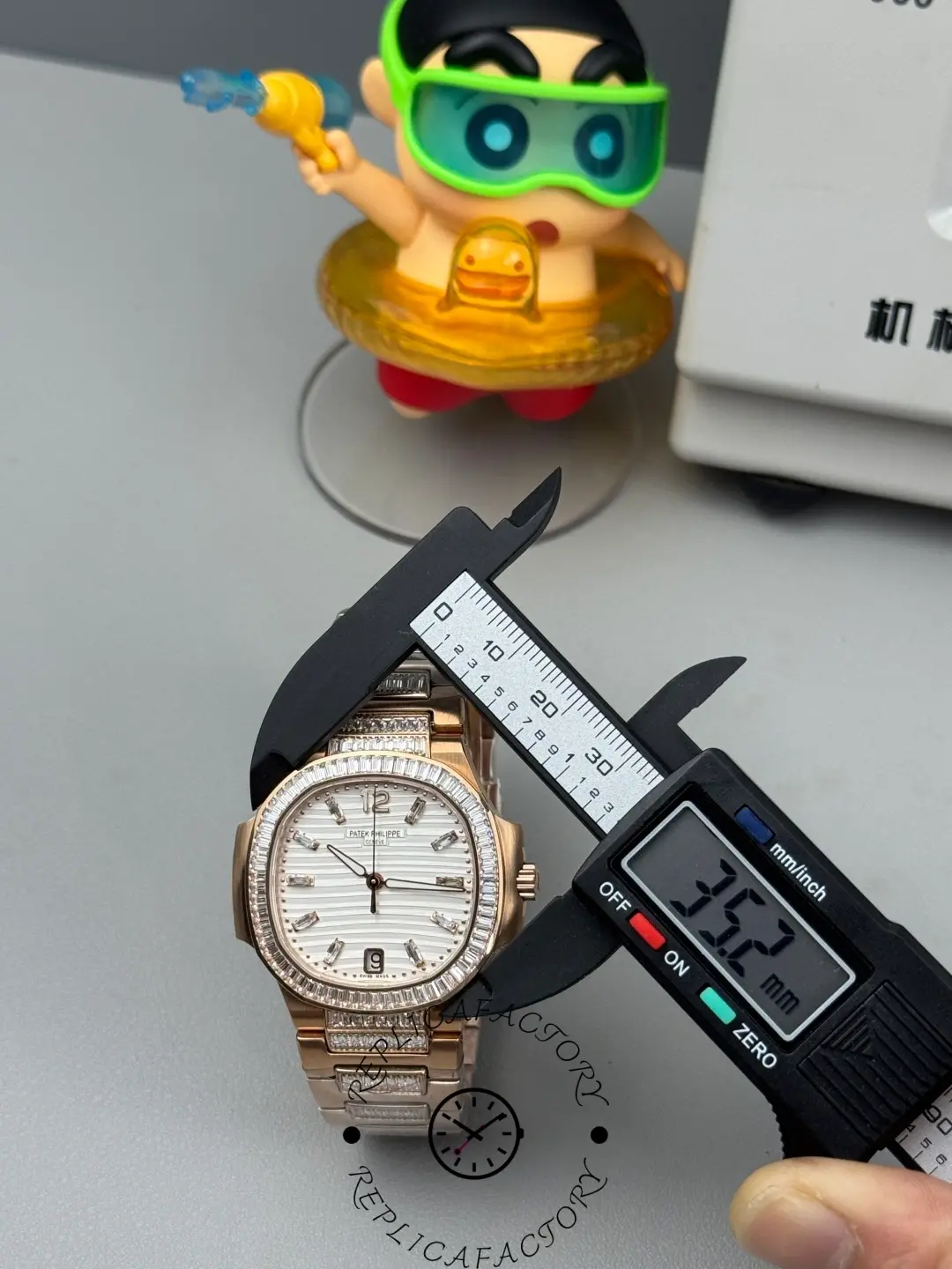 Size measurement of Patek Philippe Nautilus 7014/1R-001 replica using digital caliper.