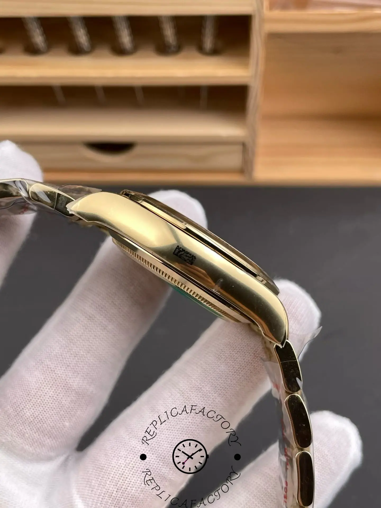 Left side profile of Rolex Daytona 116508 highlighting polished yellow gold case thickness.