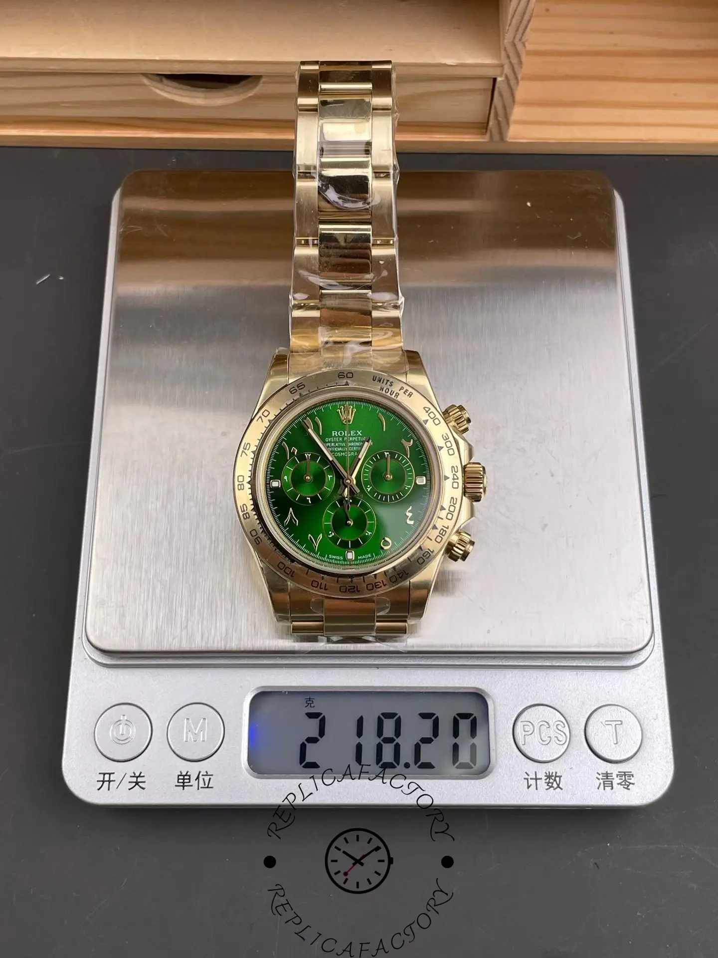 Top view of Rolex Daytona 116508 on digital scale showing yellow gold case, bracelet and total weight.