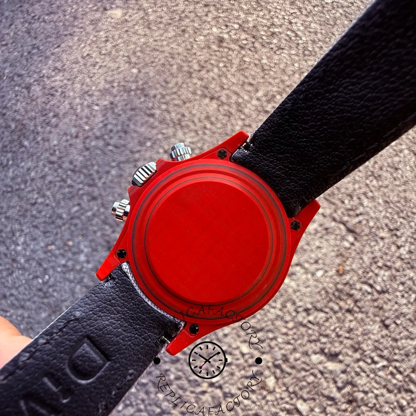 Case back view of the Rolex Daytona DiW showing solid red case back and carbon case construction.