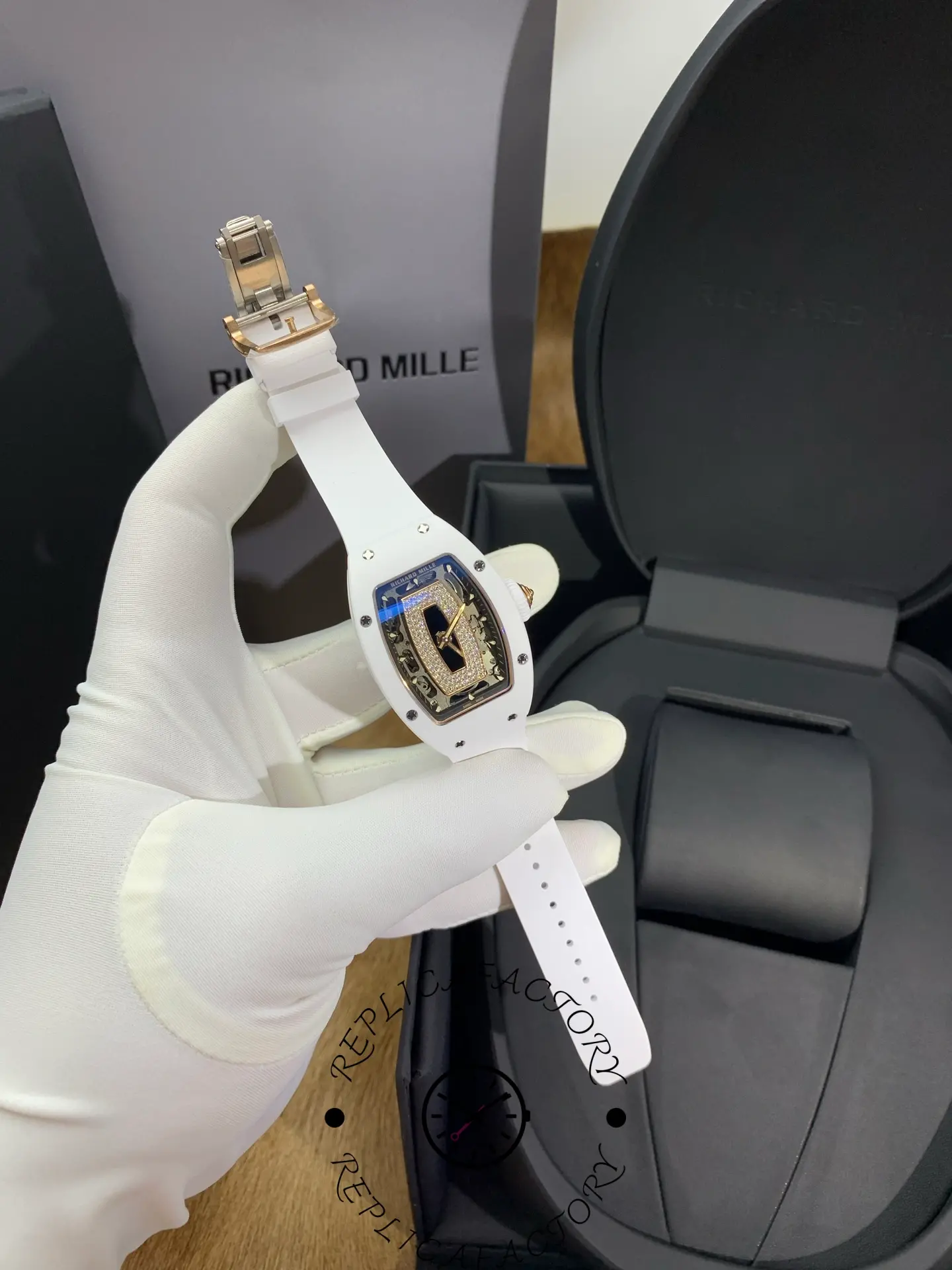 Full watch view of Richard Mille RM 07-01 with white rubber strap and tonneau case.