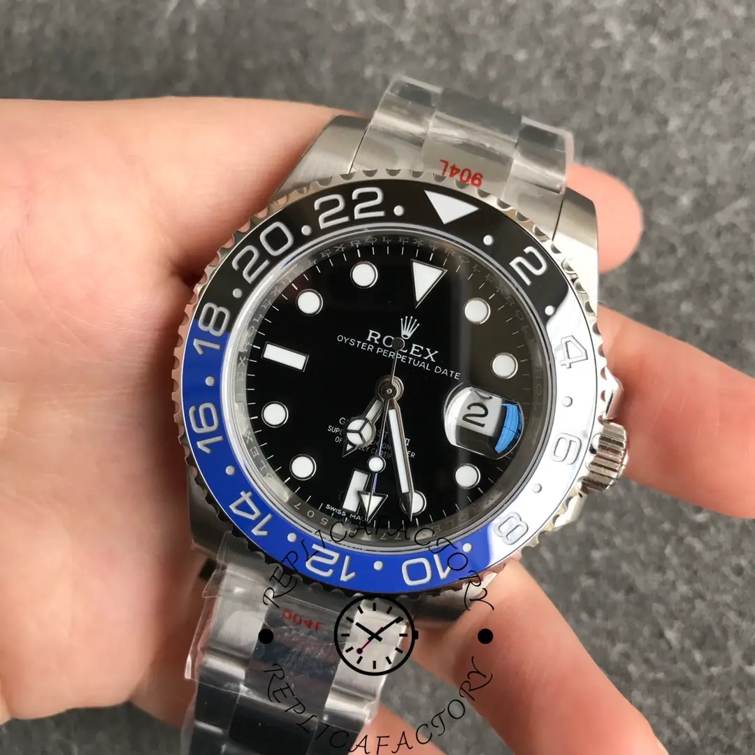 Top-down view of Rolex GMT-Master II 116710BLNR on gray background with Oyster case details.