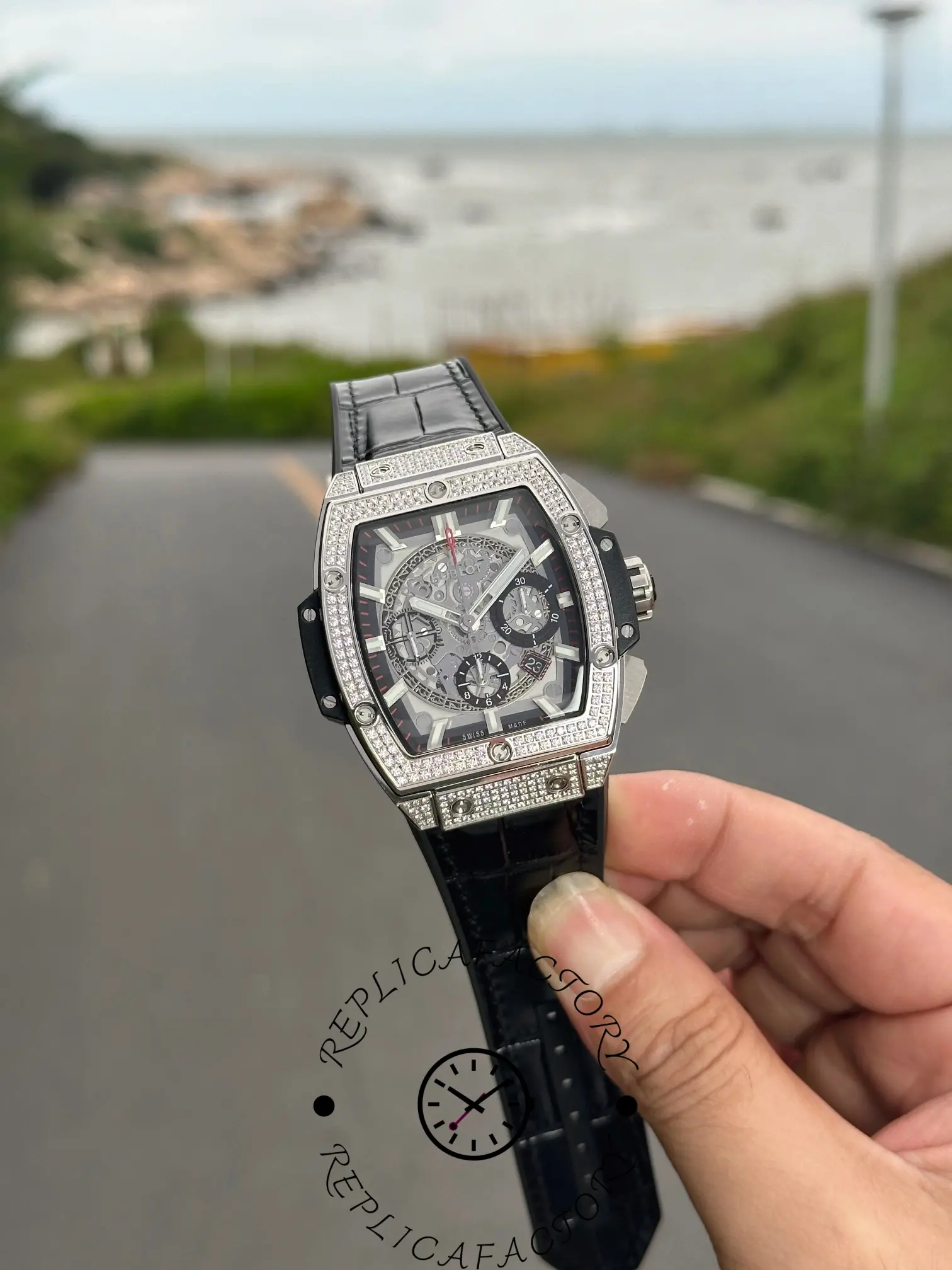 Handheld front angle of Hublot Spirit of Big Bang 601.NX.0173.LR.1704 highlighting tonneau case design.