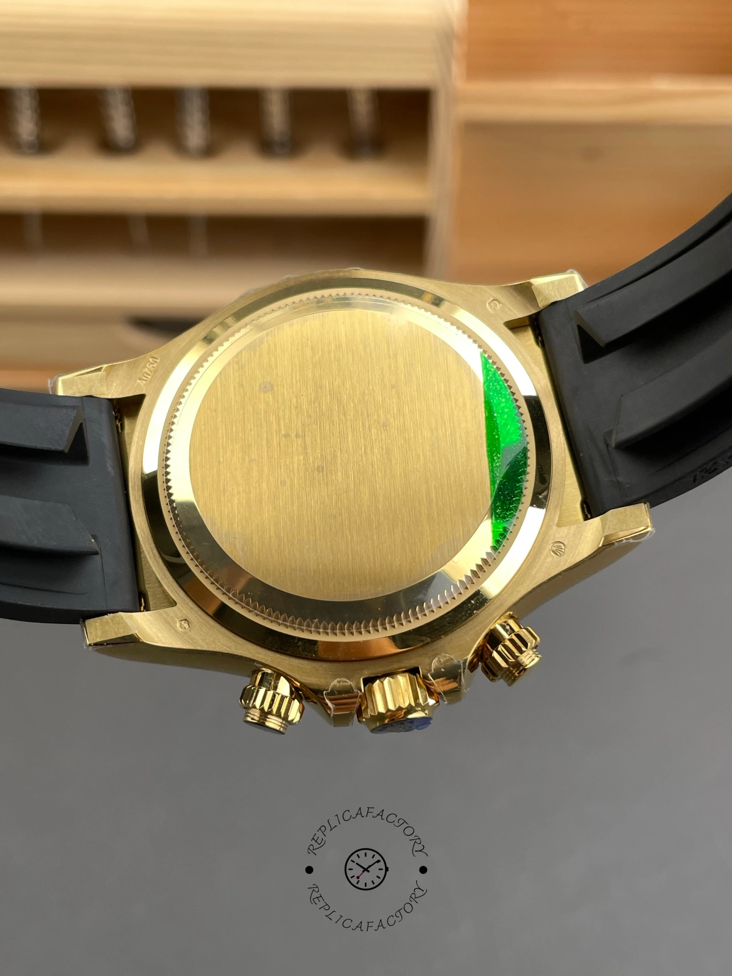 Rolex Daytona 126518LN 0014, caseback view with gold-tone back and sticker.