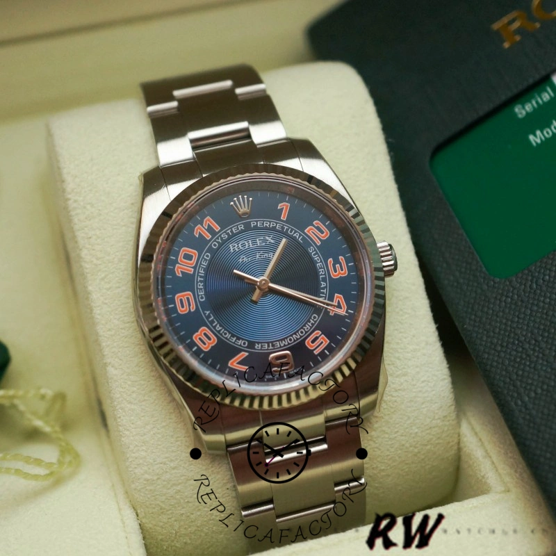 Rolex Air-King 114234, real photo showing blue dial, baton markers, and fluted bezel.