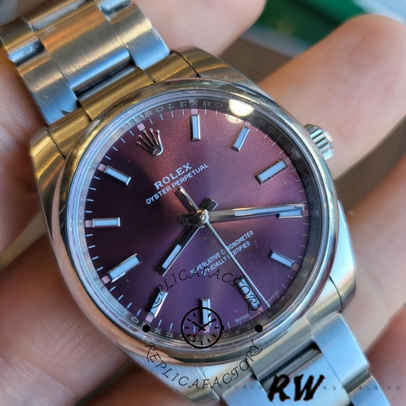 Rolex Oyster Perpetual Air-King 114200, grape red dial wrist shot, index markers visible.