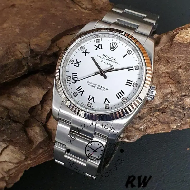 Rolex Oyster Perpetual Air-King 114234, white diamond dial 34mm, angled view on stone background.