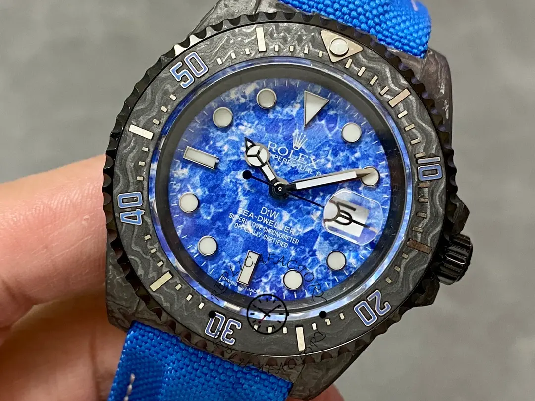 Rolex Sea-Dweller DiW Carbon Fiber, ocean blue dial, macro shot of markers.