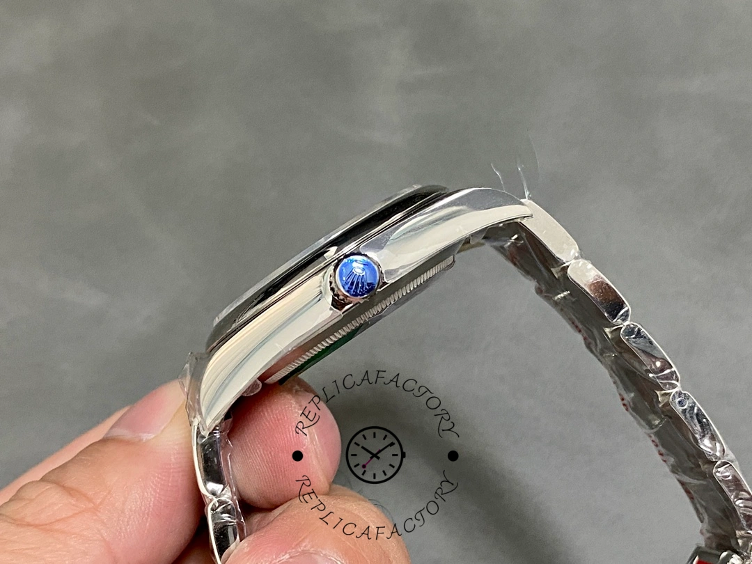 Rolex Oyster Perpetual Air-King 114200, bracelet side view showing crown and link details.