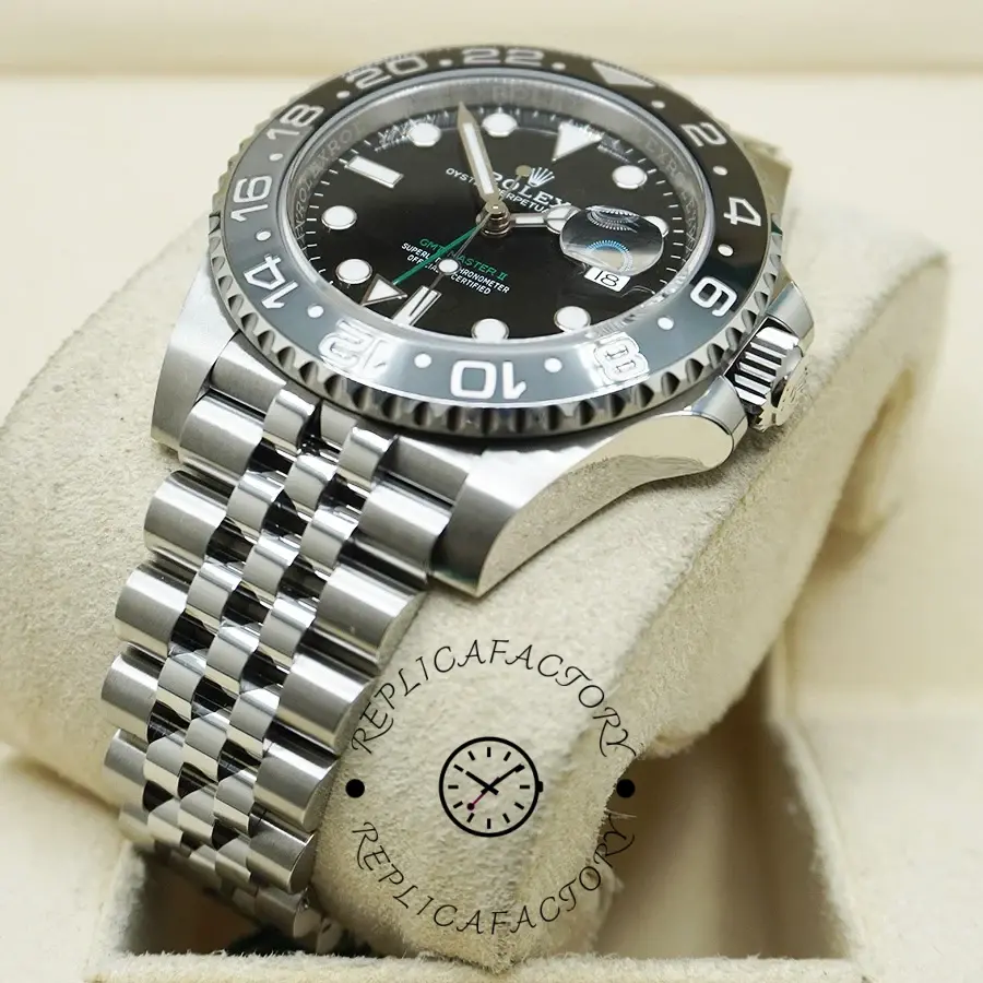 Rolex GMT-Master II M126710GRNR 0003, angled pillow view showing bezel and Jubilee links.