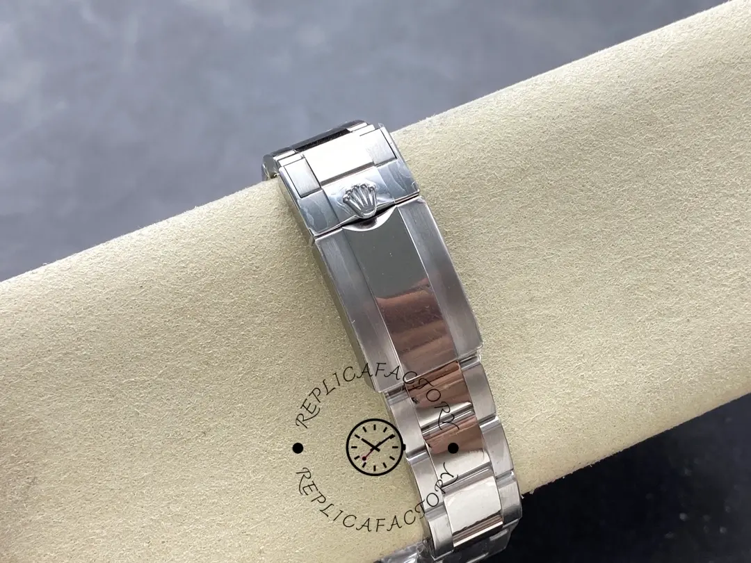 Bracelet clasp view of the Rolex GMT-Master II 126710BLRO 0002 on pillow, clasp closed.