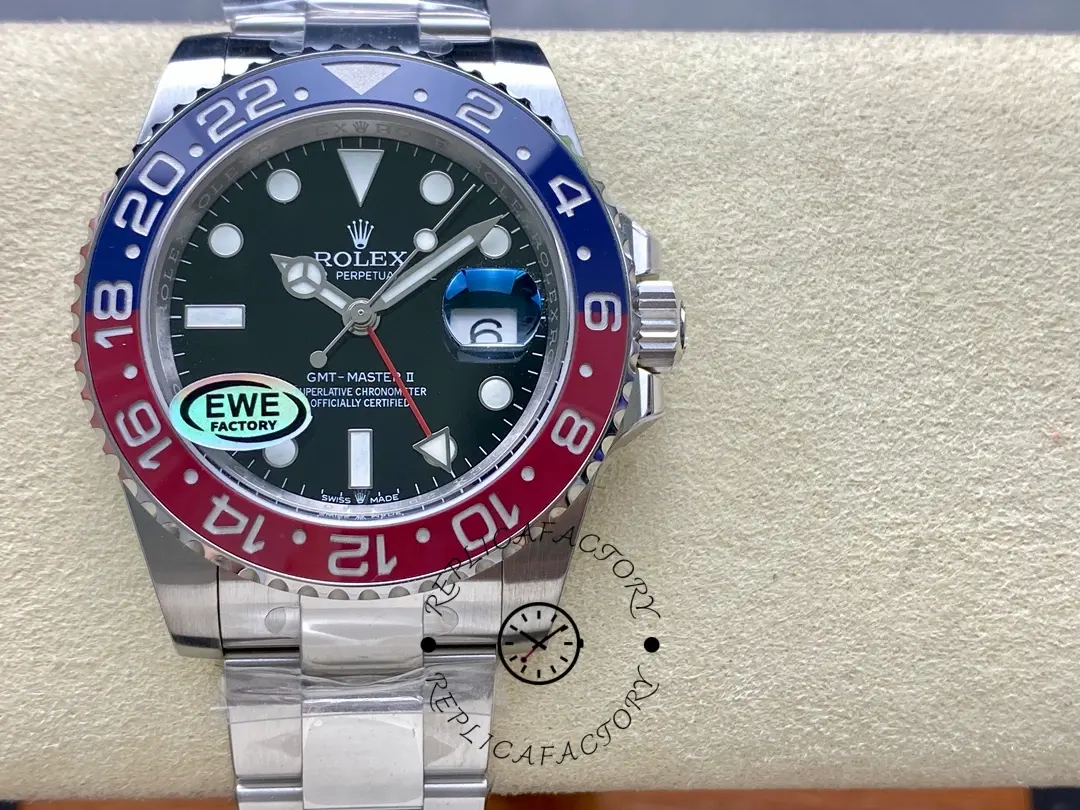 Rolex GMT-Master II 126710BLRO 0002 on cushion, front view with red-blue bezel and green hand.