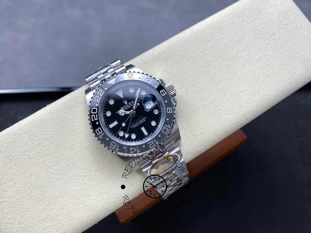 Rolex GMT-Master II M126710GRNR 0003, full watch on cushion showing Jubilee bracelet.