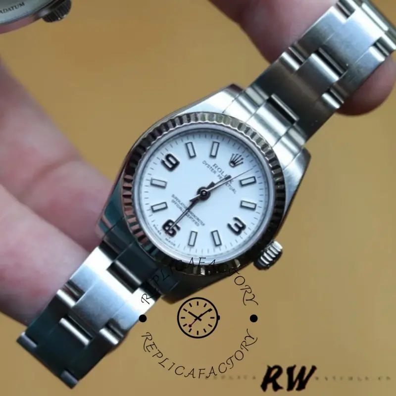 Rolex Oyster Perpetual 176234, hand-held close-up showing white Roman dial and fluted bezel.