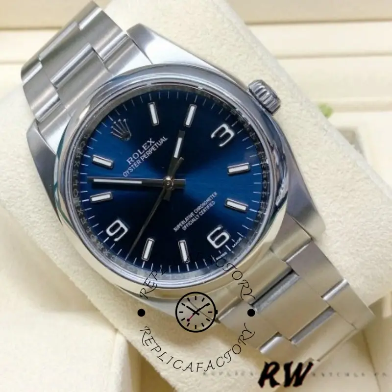 Rolex Oyster Perpetual 116000 on pillow, close front view showing blue dial and smooth bezel.