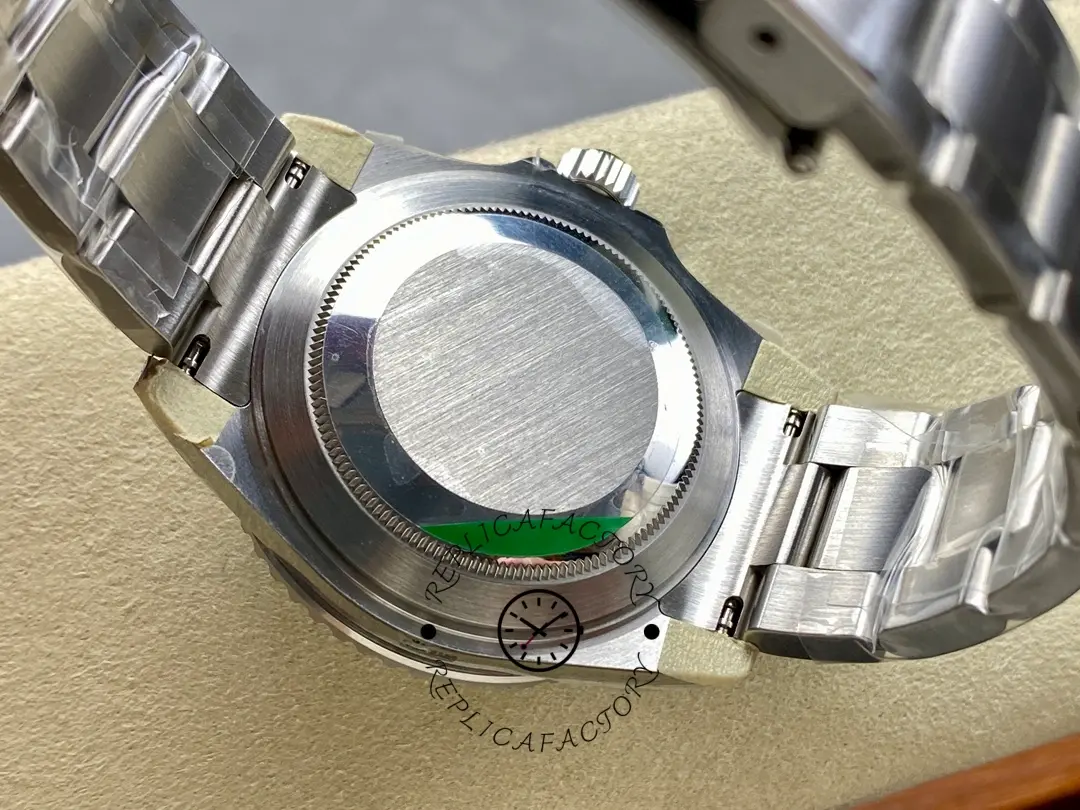 Rolex Submariner 16610 caseback view, protective sticker on the back visible.
