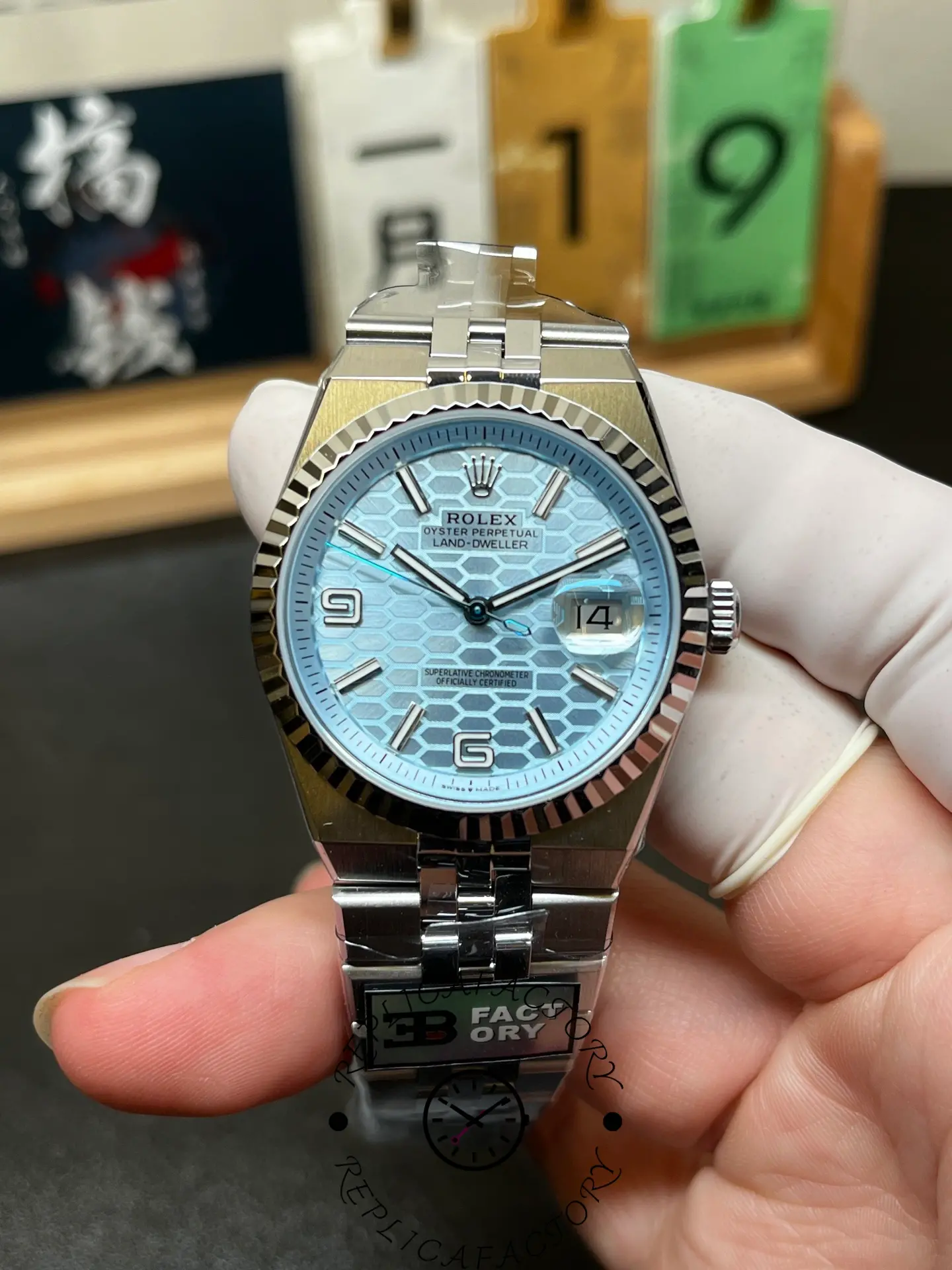 Front view of Rolex Land-Dweller 36 m127236-0001 showing ice blue honeycomb dial and date window at 3 o’clock.