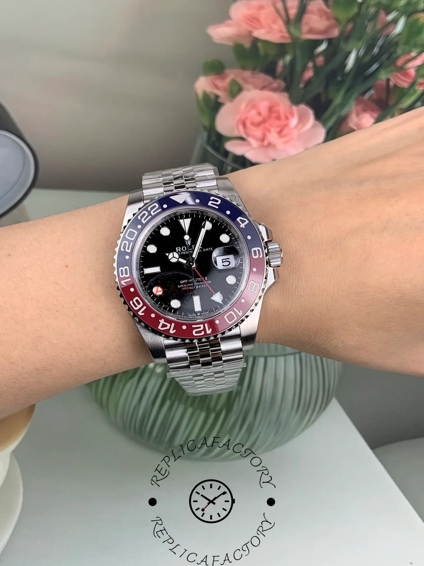 Rolex GMT-Master II 126710BLRO worn on wrist, showing Pepsi bezel, black dial and Jubilee bracelet.