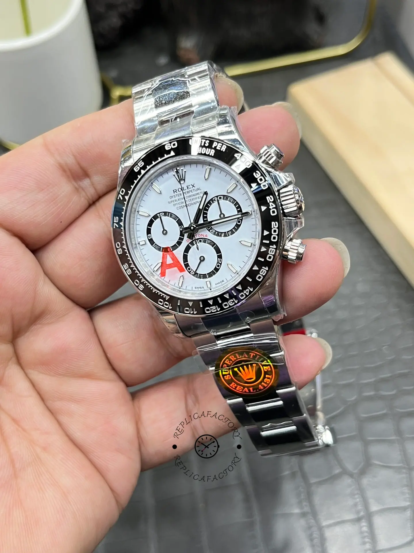 Rolex Daytona M126500LN-0001 handheld side view, case profile and pushers visible.