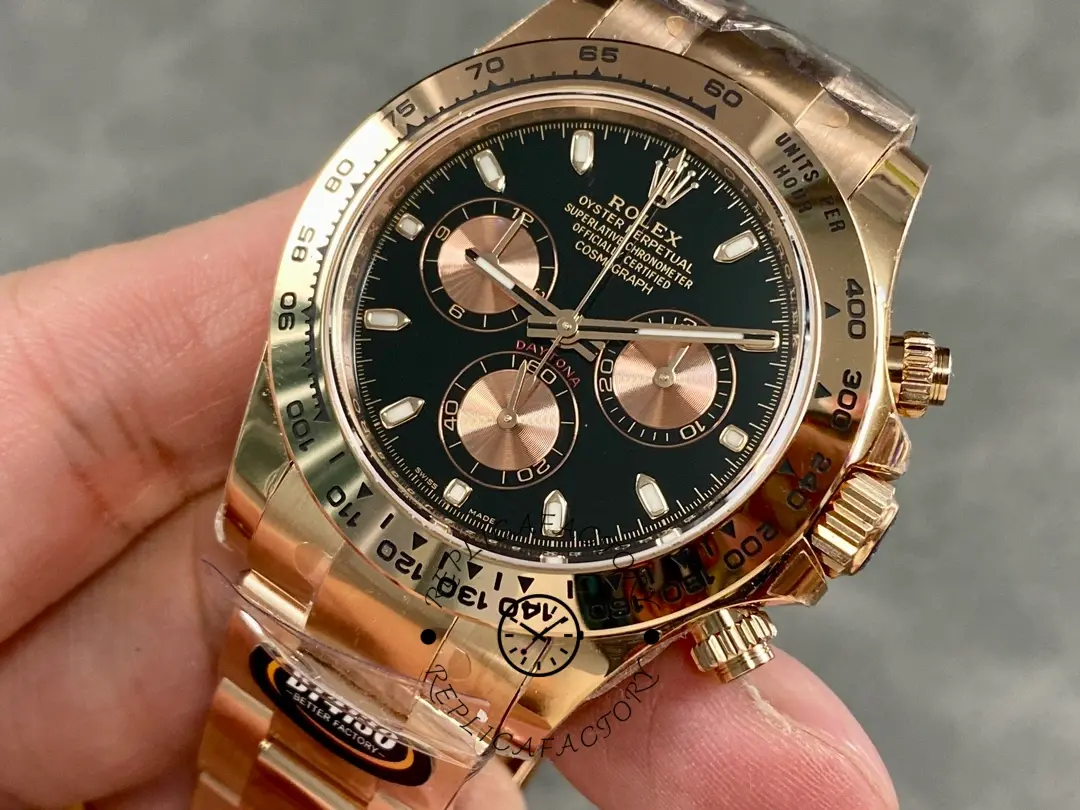 Close-up in hand of Rolex Daytona 126505-0001 highlighting black dial and subdials.